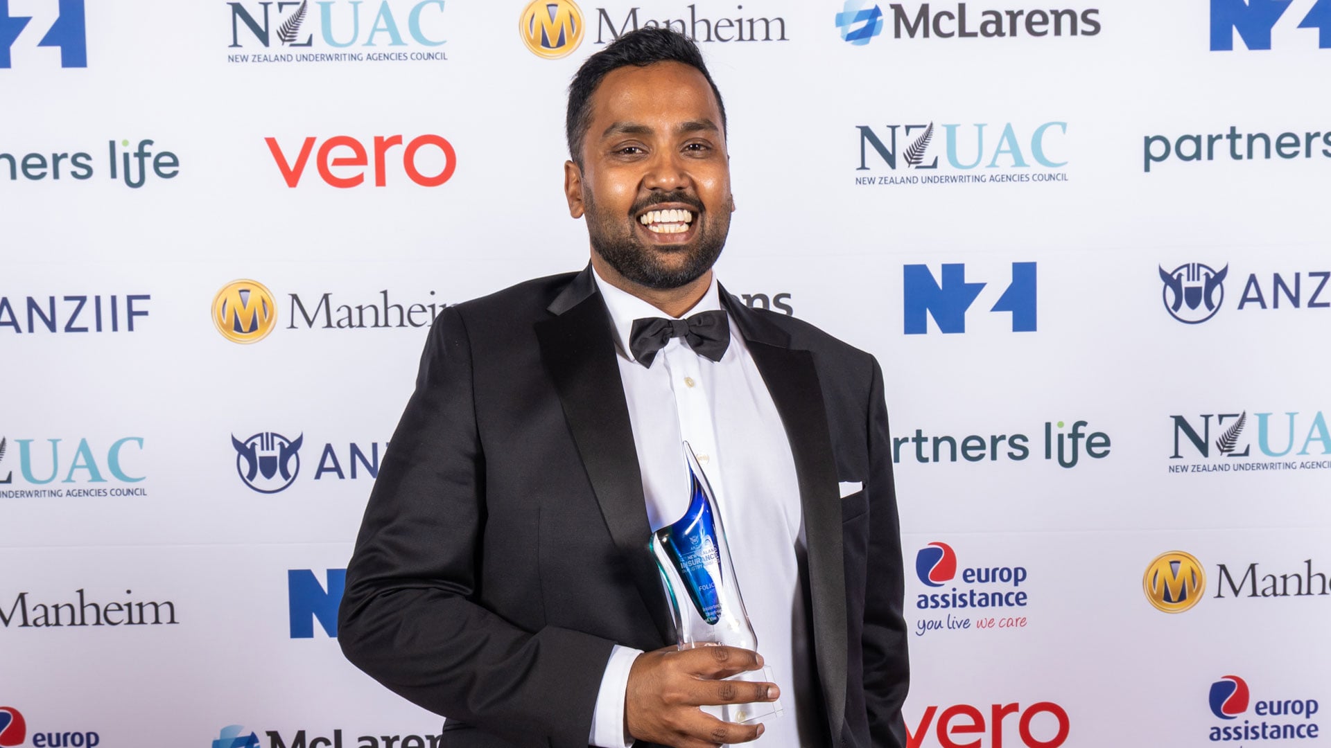 Roneel Kumar with his trophy for 2025 ANZIIF New Zealand Insurance Industry Awards