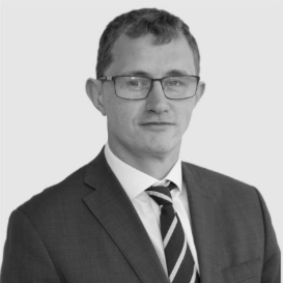 Adrian Kerins headshot Greyscale